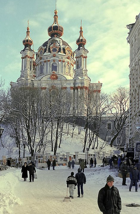 St. Andrew's Church: Sits atop a snowy hill as locals dress warmly, 1998.