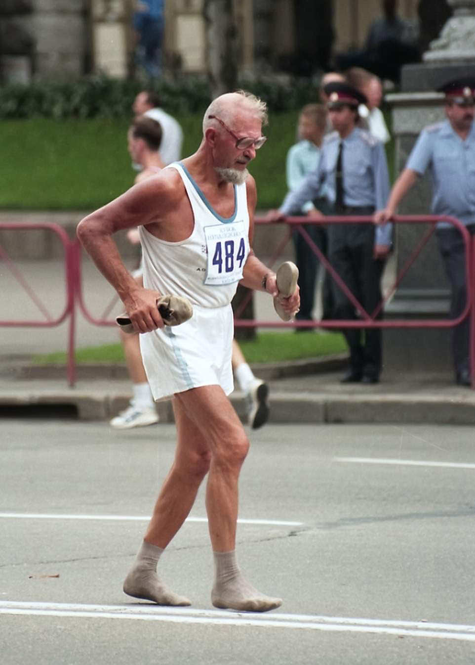 Shoeless Race: Man finishes a race barefoot, demonstrating determination, 1998.