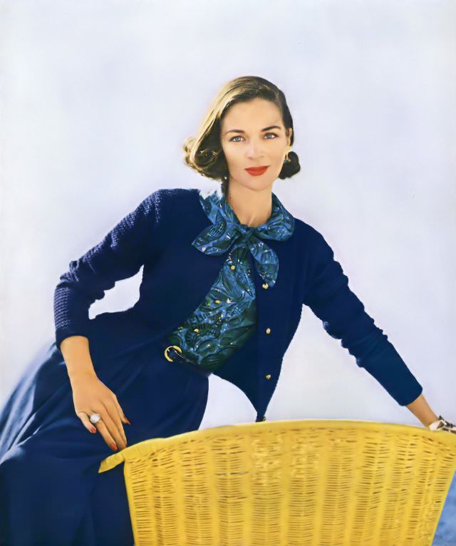 Theo Graham in a blue popcorn stitch cardigan jacket and print ensemble by Masket Bros., 1955.