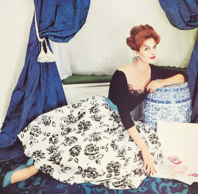 Anne St. Marie in a black jersey blouse and printed rose silk shantung skirt, 1958.
