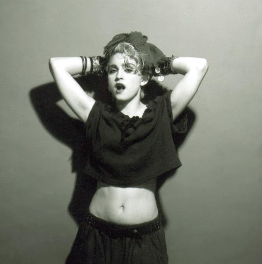 A Belly Button, Platinum Hair, and Pop Stardom: Diving Deep into Madonna's Iconic Debut Album Photoshoot