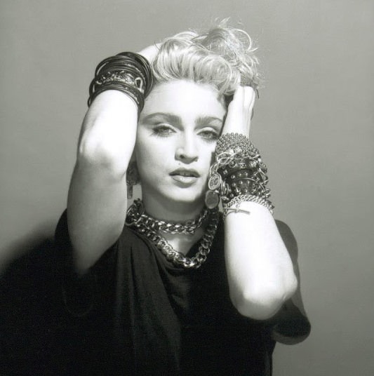 A Belly Button, Platinum Hair, and Pop Stardom: Diving Deep into Madonna's Iconic Debut Album Photoshoot