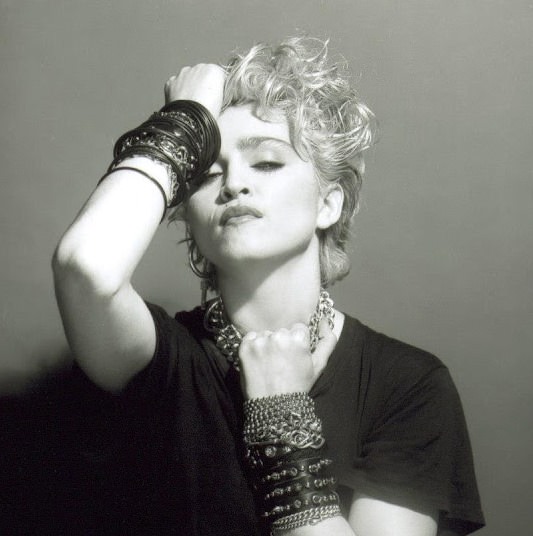 A Belly Button, Platinum Hair, and Pop Stardom: Diving Deep into Madonna's Iconic Debut Album Photoshoot