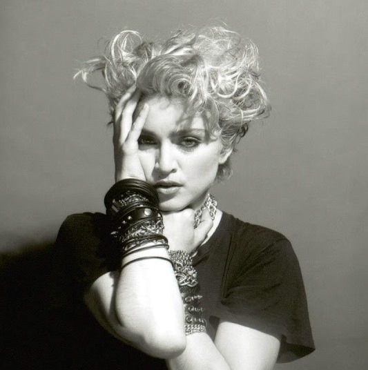 A Belly Button, Platinum Hair, and Pop Stardom: Diving Deep into Madonna's Iconic Debut Album Photoshoot