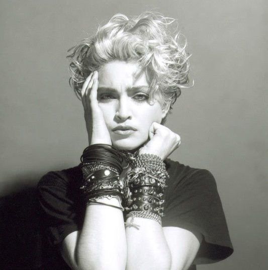 A Belly Button, Platinum Hair, and Pop Stardom: Diving Deep into Madonna's Iconic Debut Album Photoshoot