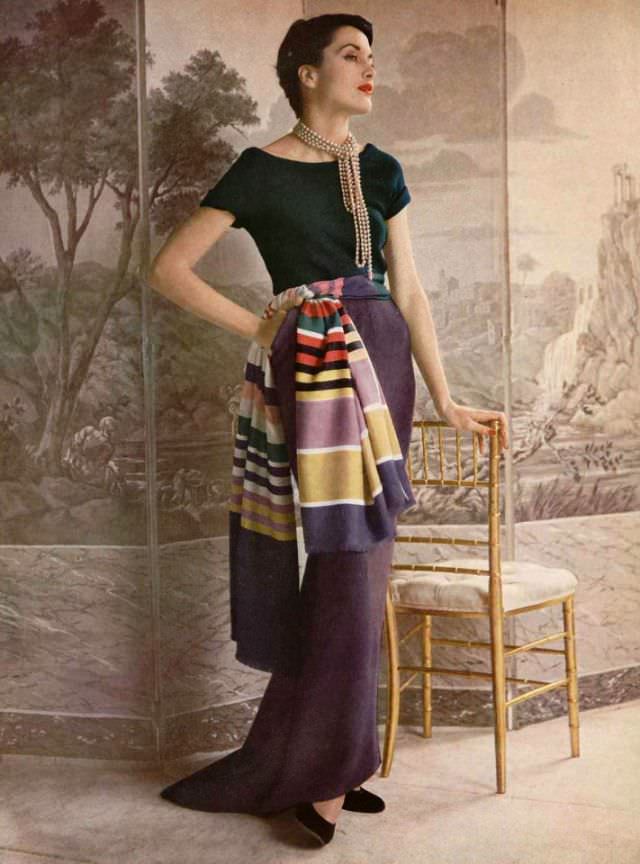 Maxime de la Falaise in green sweater and violet skirt by Manguin, 1950.