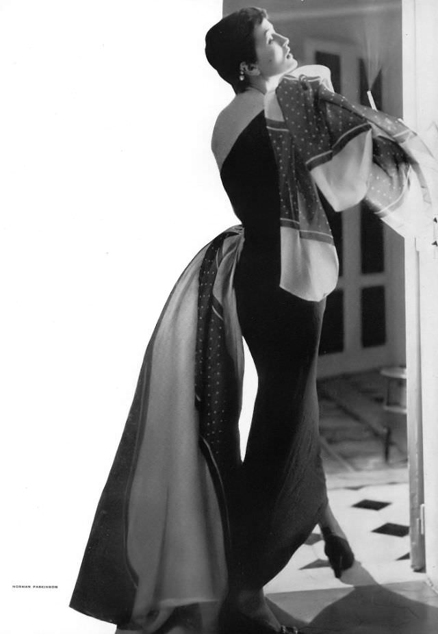 Maxime de la Falaise in shantung evening sheath with organdy kerchiefs by Schiaparelli, 1950.