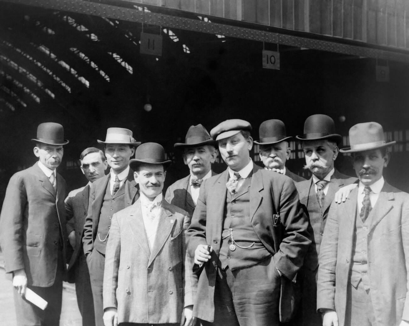 Men in suits and hats at Pennsylvania Railroad Station in Pittsburgh, early 1900s.