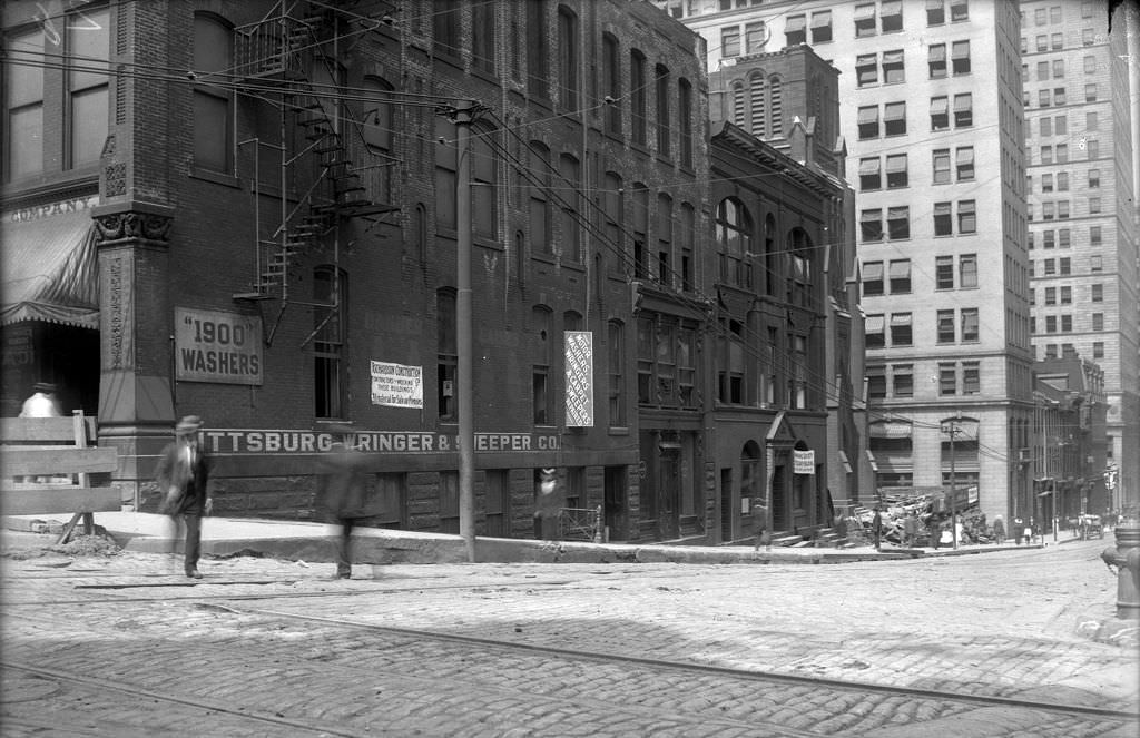 Sixth Avenue, south side looking west from Grant, 1910s