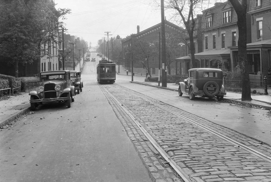 81 Atwood Trolley, Ward Street view with 81 Atwood trolley and NRA signs, 1933.