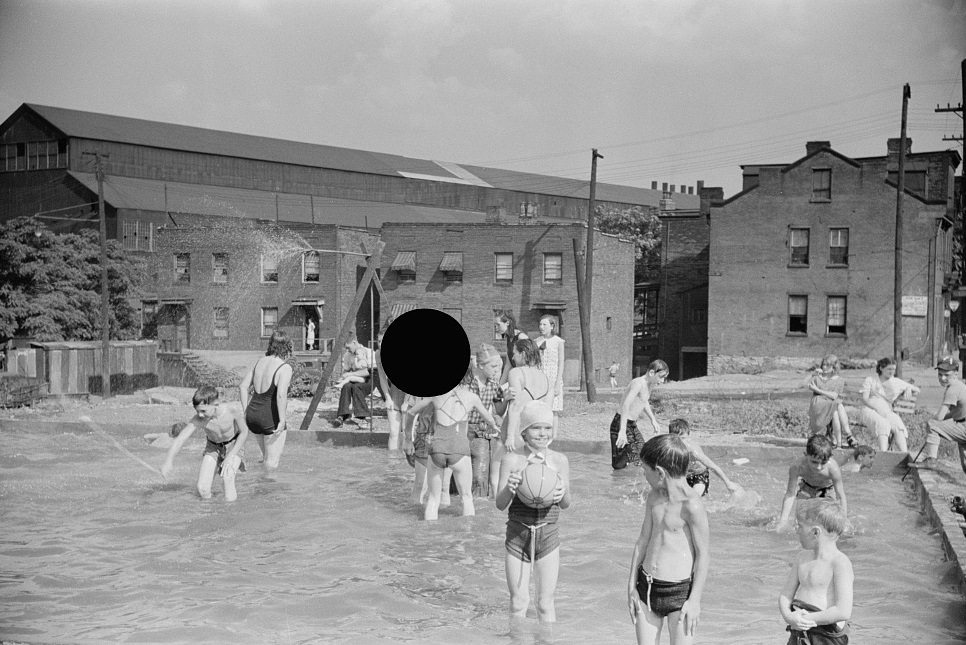 Homemade pool by steelworkers for their children, Pittsburgh, Pennsylvania, 1938.