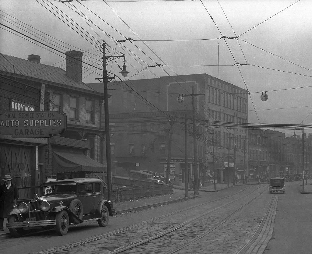 Businesses at the intersection of Center Avenue and Devilliers Street, 1933