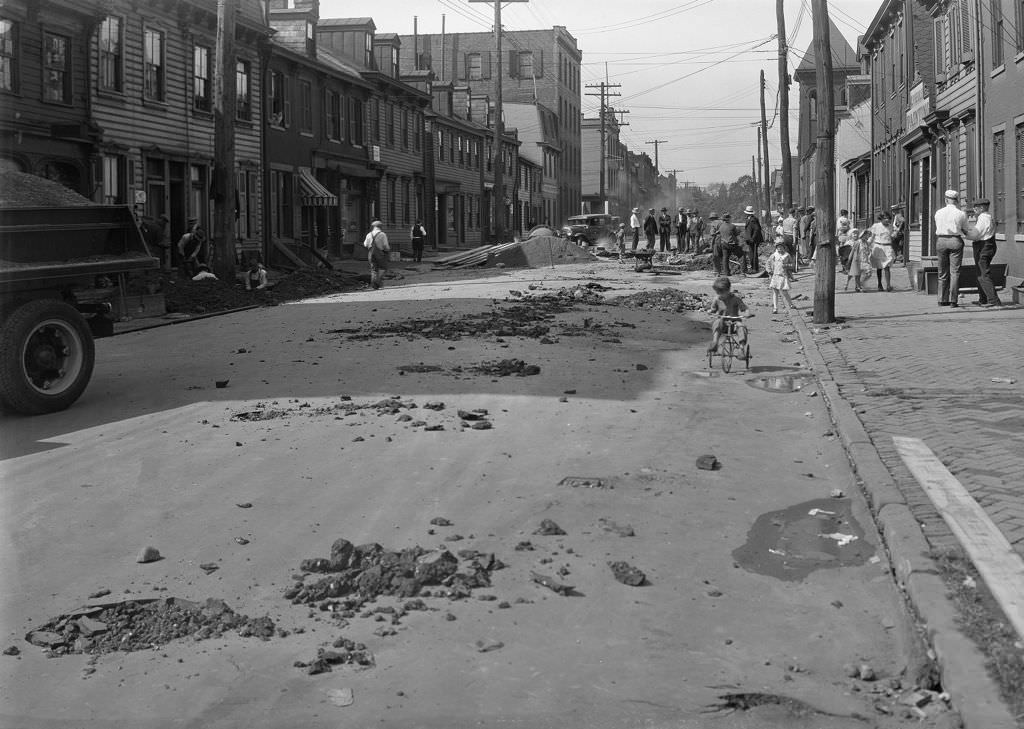 Suismon Street water main break showing road conditions, 1930