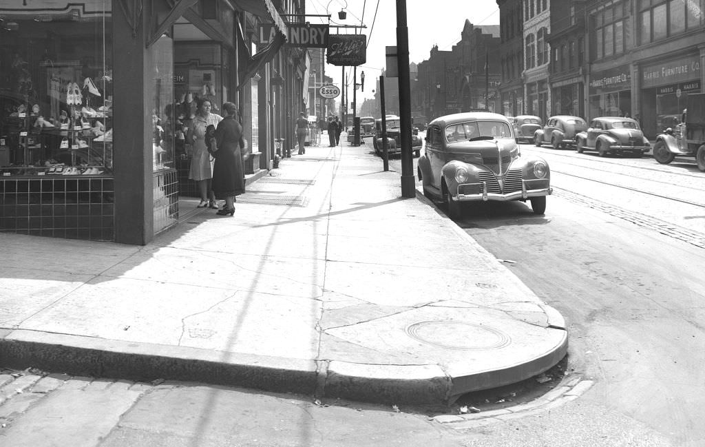 1501 Fifth Avenue, looking west showing Harris Furniture Company and other local businesses, 1940