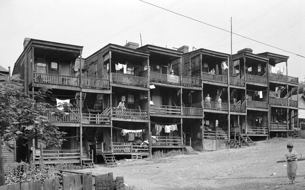 A view of an 18-family frame apartment building (Rear) on Mansion Street, 1940