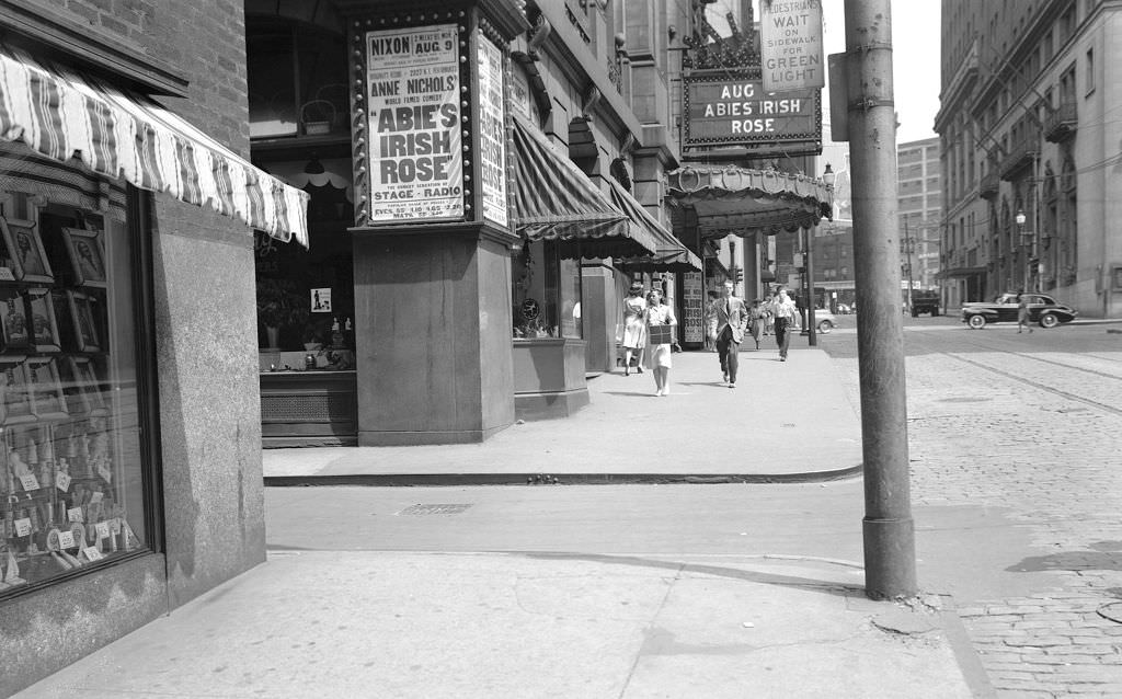 View of Nixon Theatre on Sixth Avenue and Montour Way looking east, 1943.