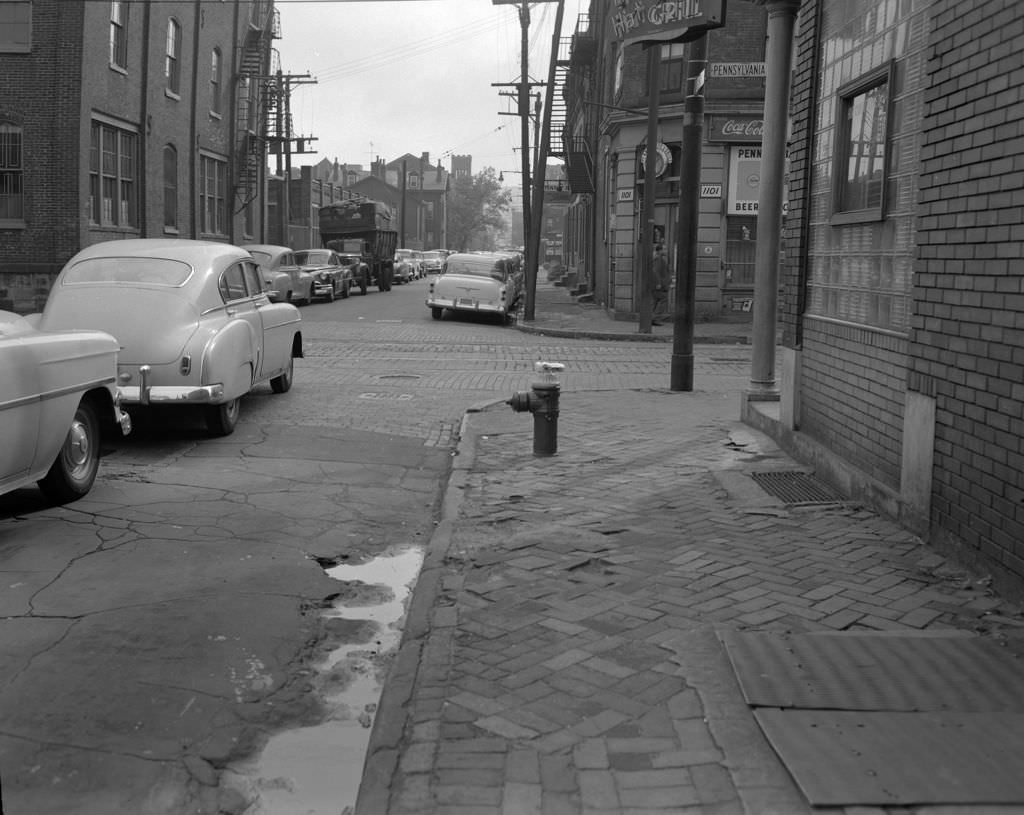 Properties along Bidwell Street at the intersection with Pennsylvania Avenue, 1956