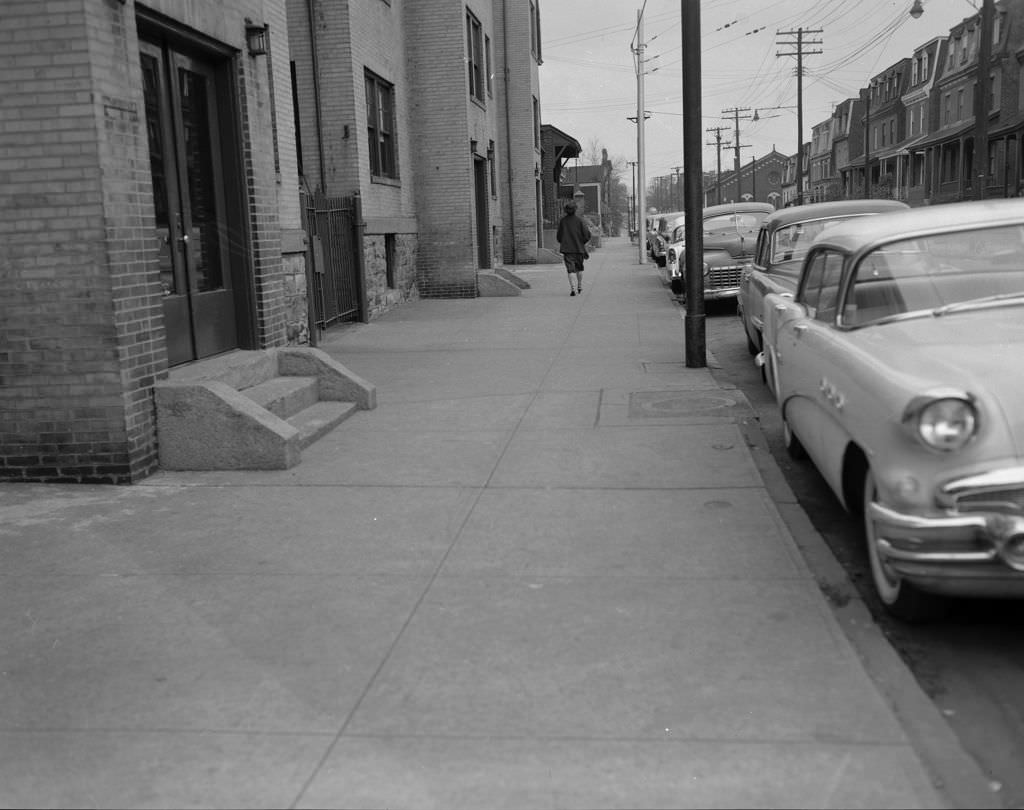 Woman walking down Ward Street, 1956