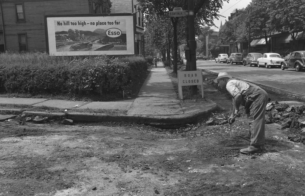 Worker Repairs Sunken Pavement on Dunfermline Street, 1950