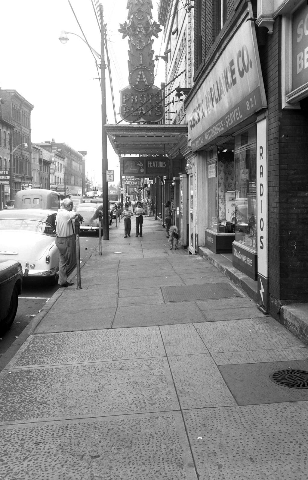 Ohio Street sidewalk featuring Acadia Theater's sign, 1951.