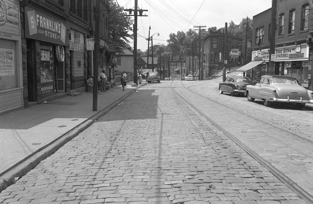 Hill District redevelopment on Herron and Wylie Avenues featuring stores, 1953.