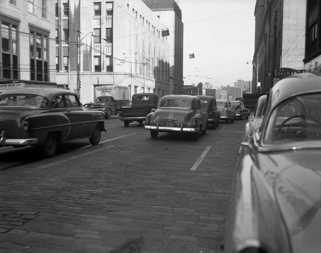 View of Grant Street to Liberty with Embassy Restaurant sign visible, 1953.