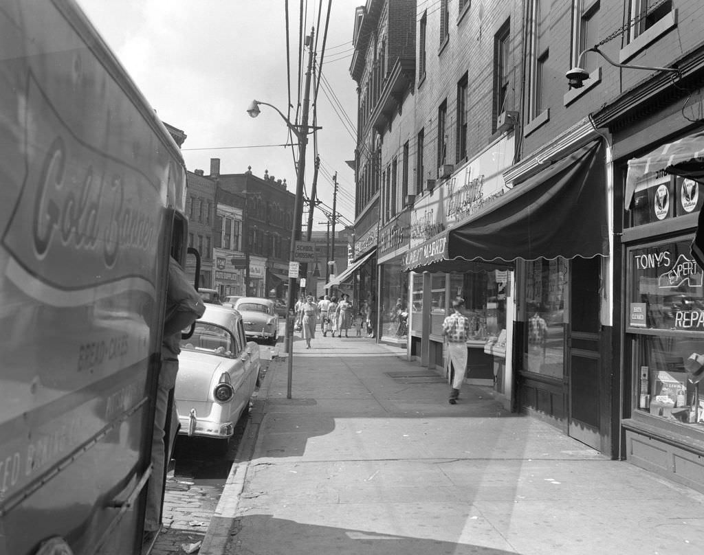Butler Street view showing pedestrians and parked Gold Banner truck, 1955.