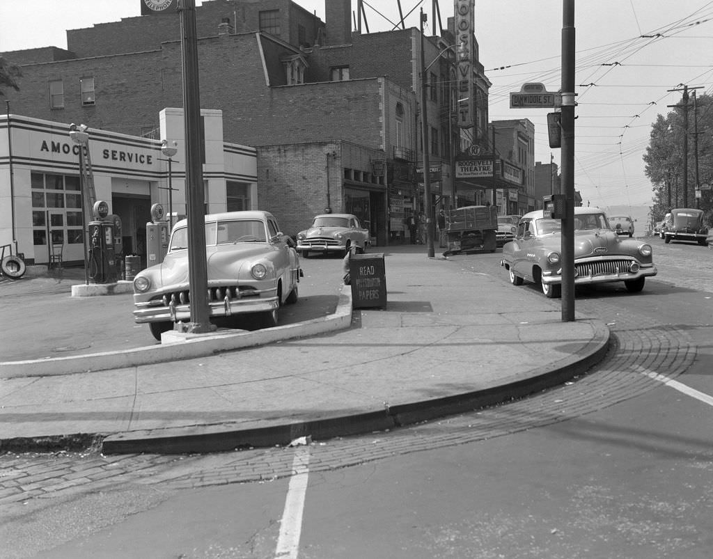 Roosevelt Theatre at Centre and Dinwiddie featuring American Oil Station, 1955.