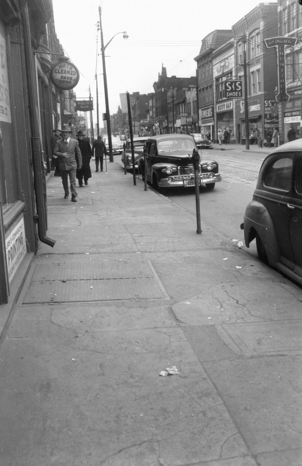 Ohio Street East shops and shoppers, including S&S Shoes and Republic Furniture Company, 1952