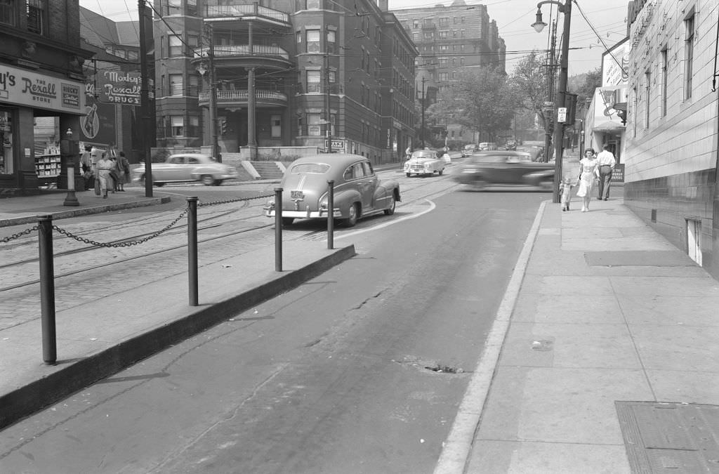 Centre Avenue near South Craig Street with Moxley's Rexall Drugs and neighborhood businesses, 1950