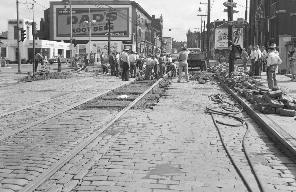 Workers repairing a water main break at Butler and 40th Street, 1950