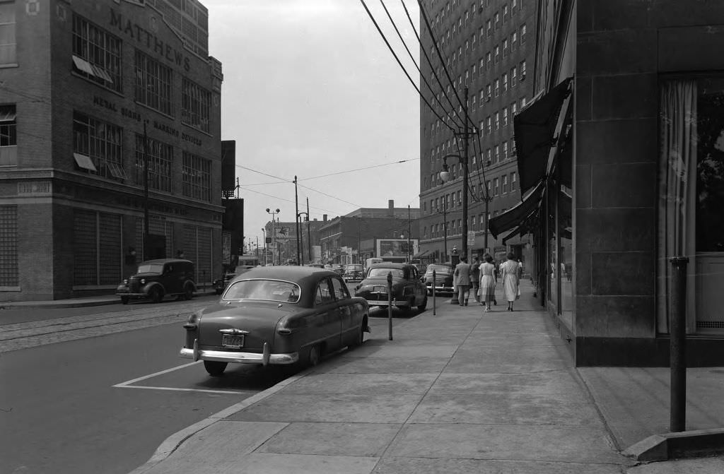 Forbes Avenue at Pennant Place showing James H. Matthews & Co. and Schenley Apartments, 1950