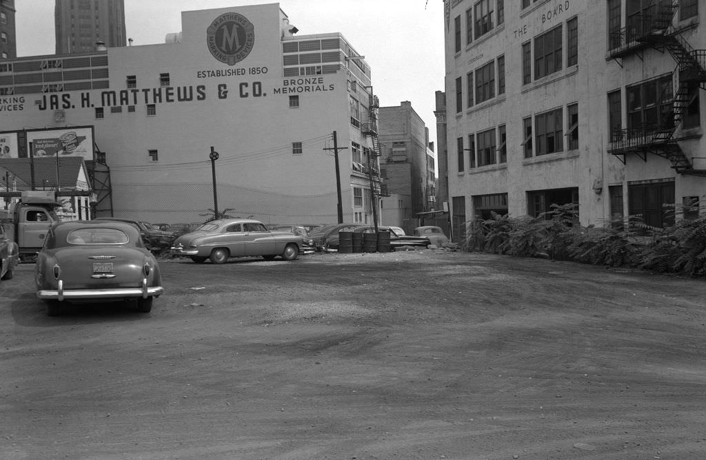 Pennant Place toward Forbes Avenue with James H. Matthews & Co. and Pittsburgh Board of Education, 1950