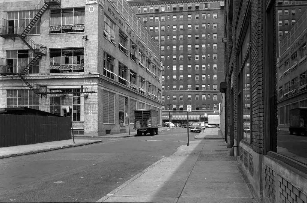 Pennant Place toward Forbes Avenue featuring James H. Matthews & Co., Schenley Apartments, and stores, 1950