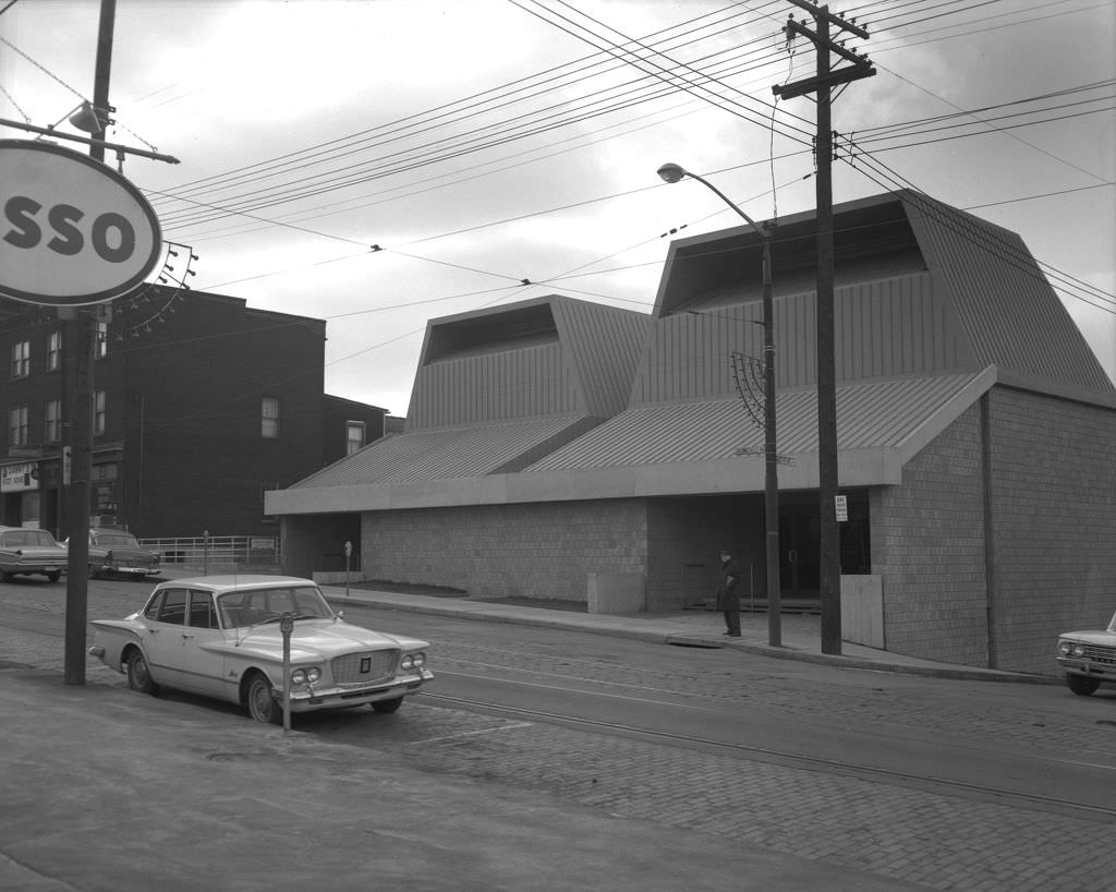 A lone man stands at the Knoxville Library, at the corner of Brownsville Road and Mathews Avenue, 1966.