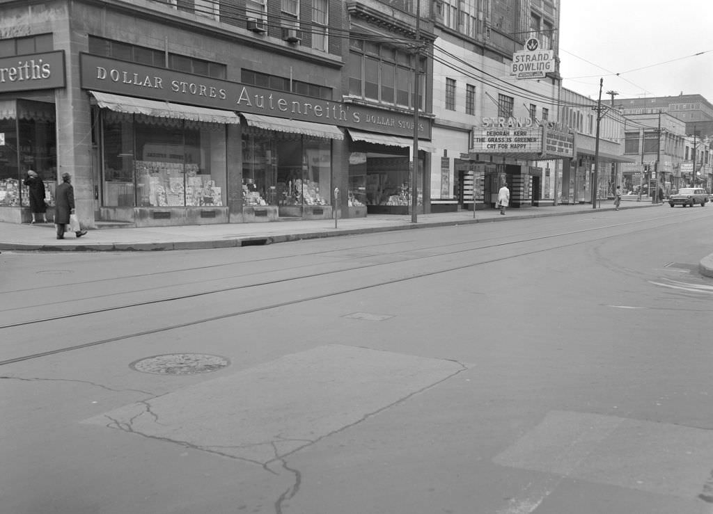 Eastward view on Forbes Avenue featuring Leonard's Mens Shop, Marshall's Restaurant, and The Strand Theatre, 1961.