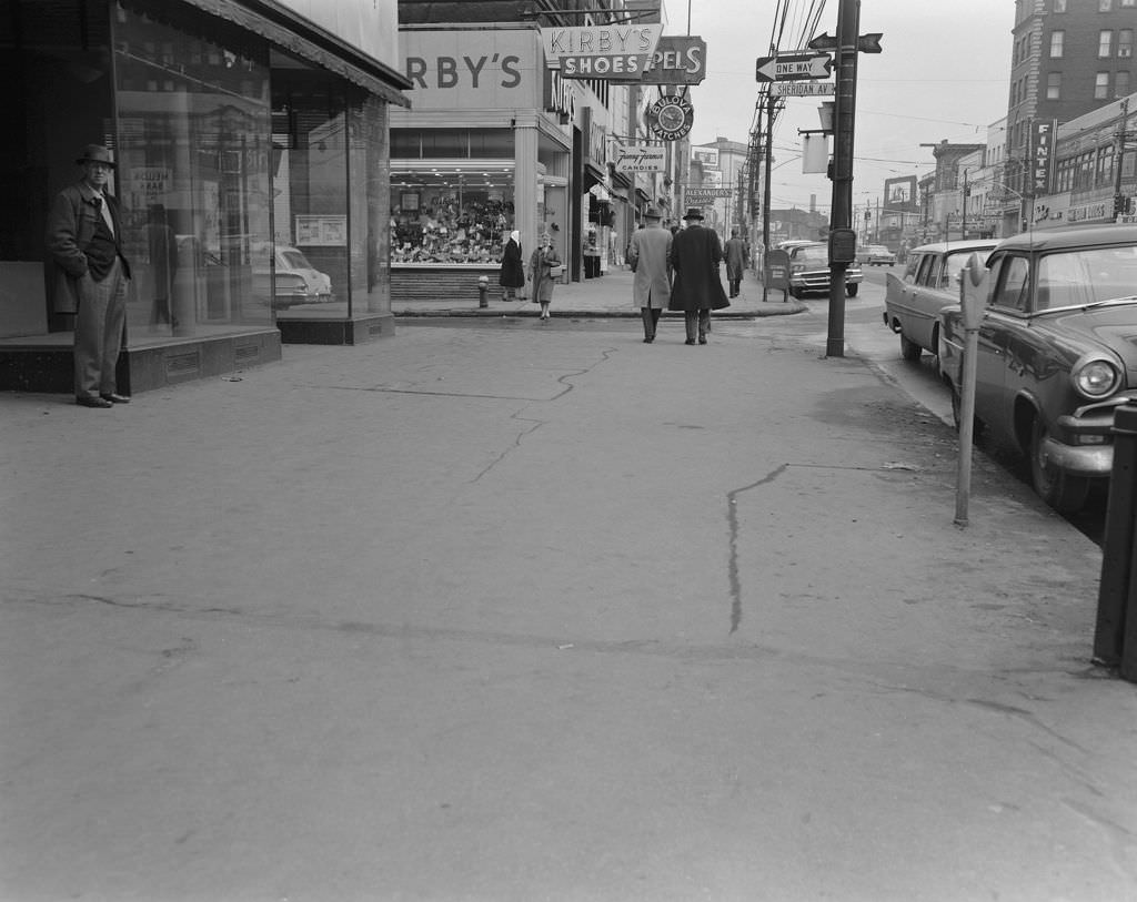 Penn Avenue in East Liberty, features local businesses including Kirby's Shoes and Fanny Farmer Candies, 1960.