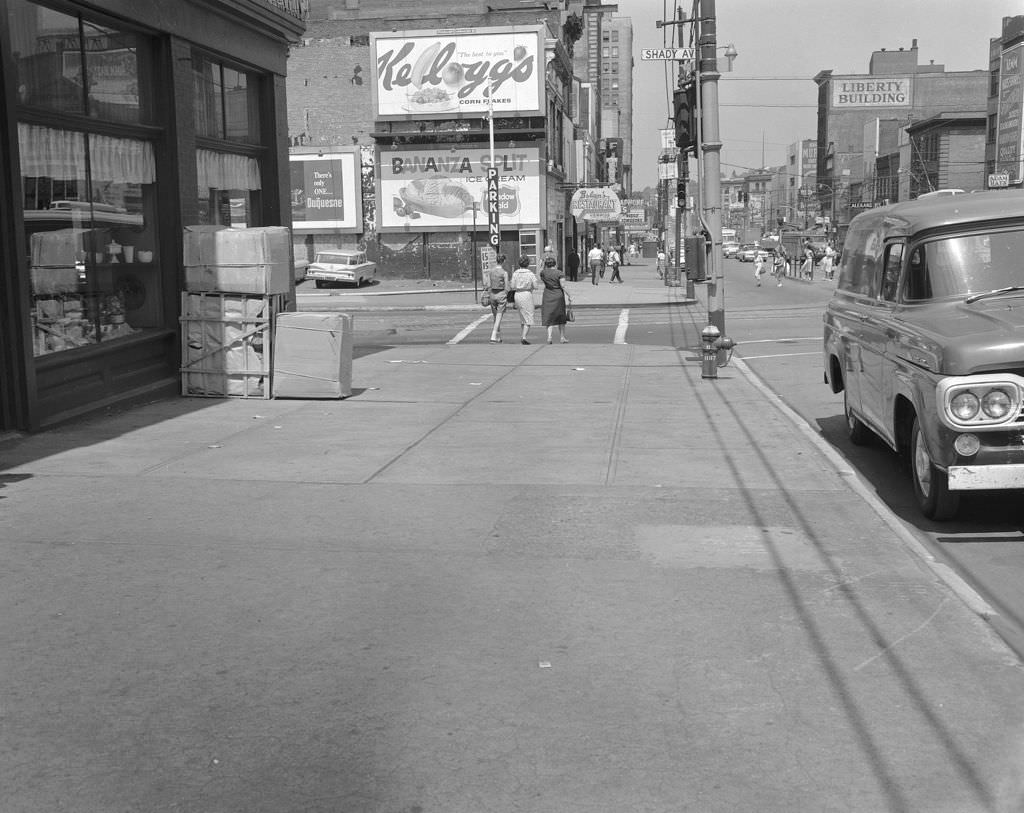 Penn Avenue repaving, from Fifth to Shady Avenues, three women in a crosswalk, 1960.