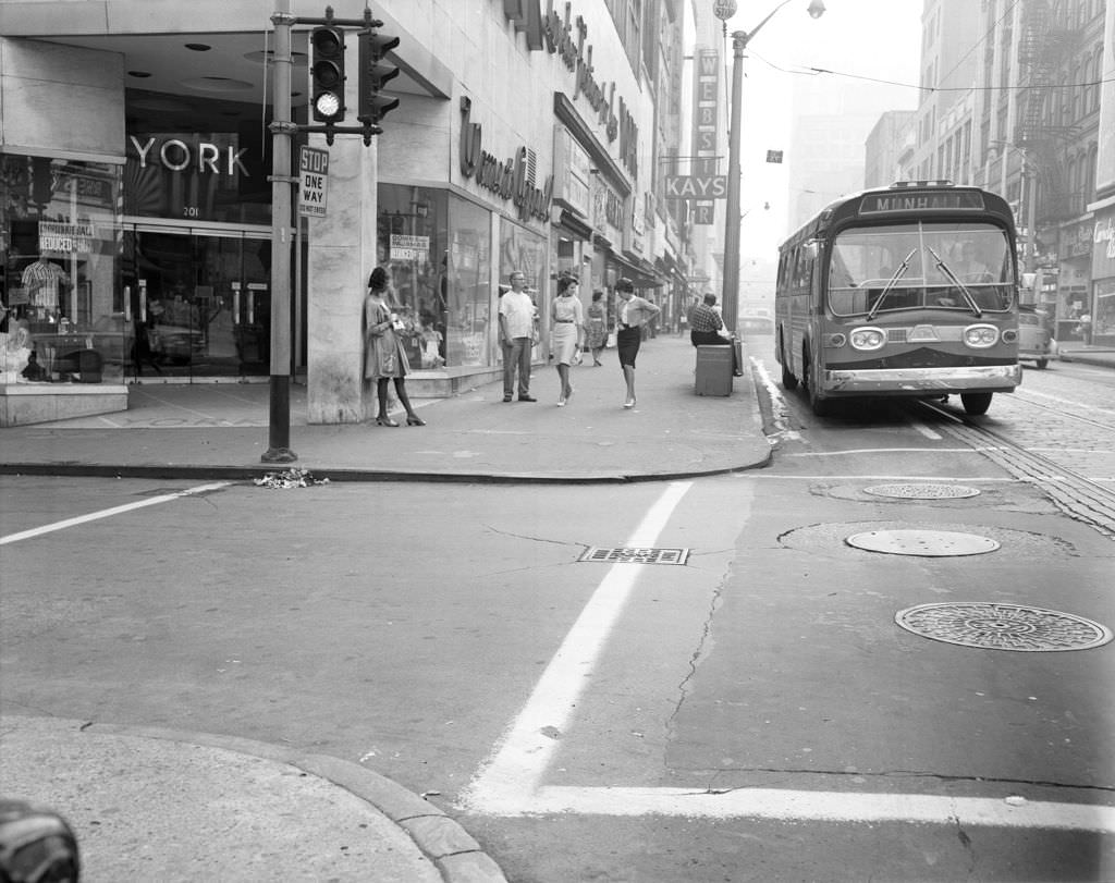 York Women's Apparel on Fifth Avenue, bus for Munhall at the curb, 1963.