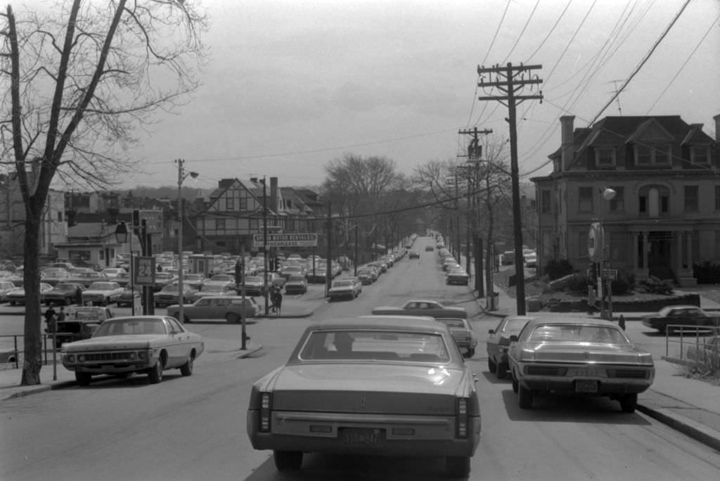 Pedestrians and traffic on McKee Place, looking towards Forbes Avenue, 1972.