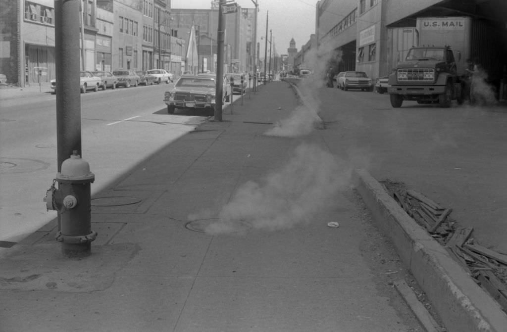 Steam from manholes on Penn Avenue at 13th Street intersection, 1972.