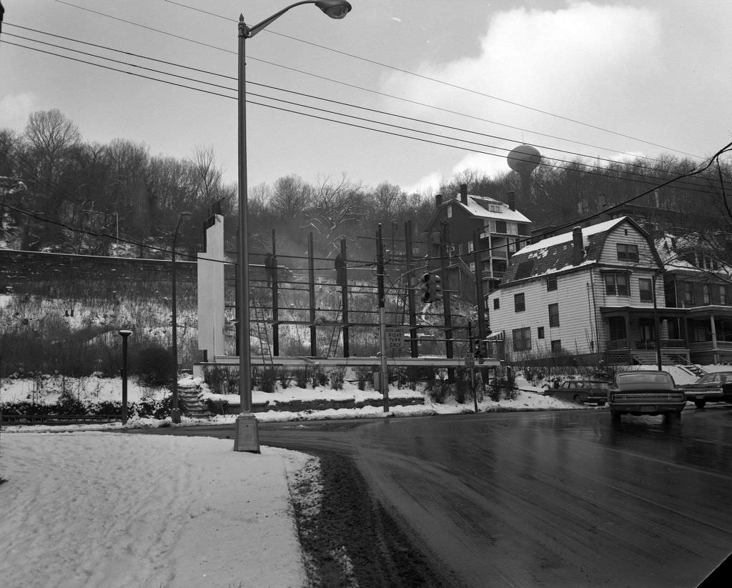 Billboard construction at Baum Boulevard and North Craig Street, 1970.