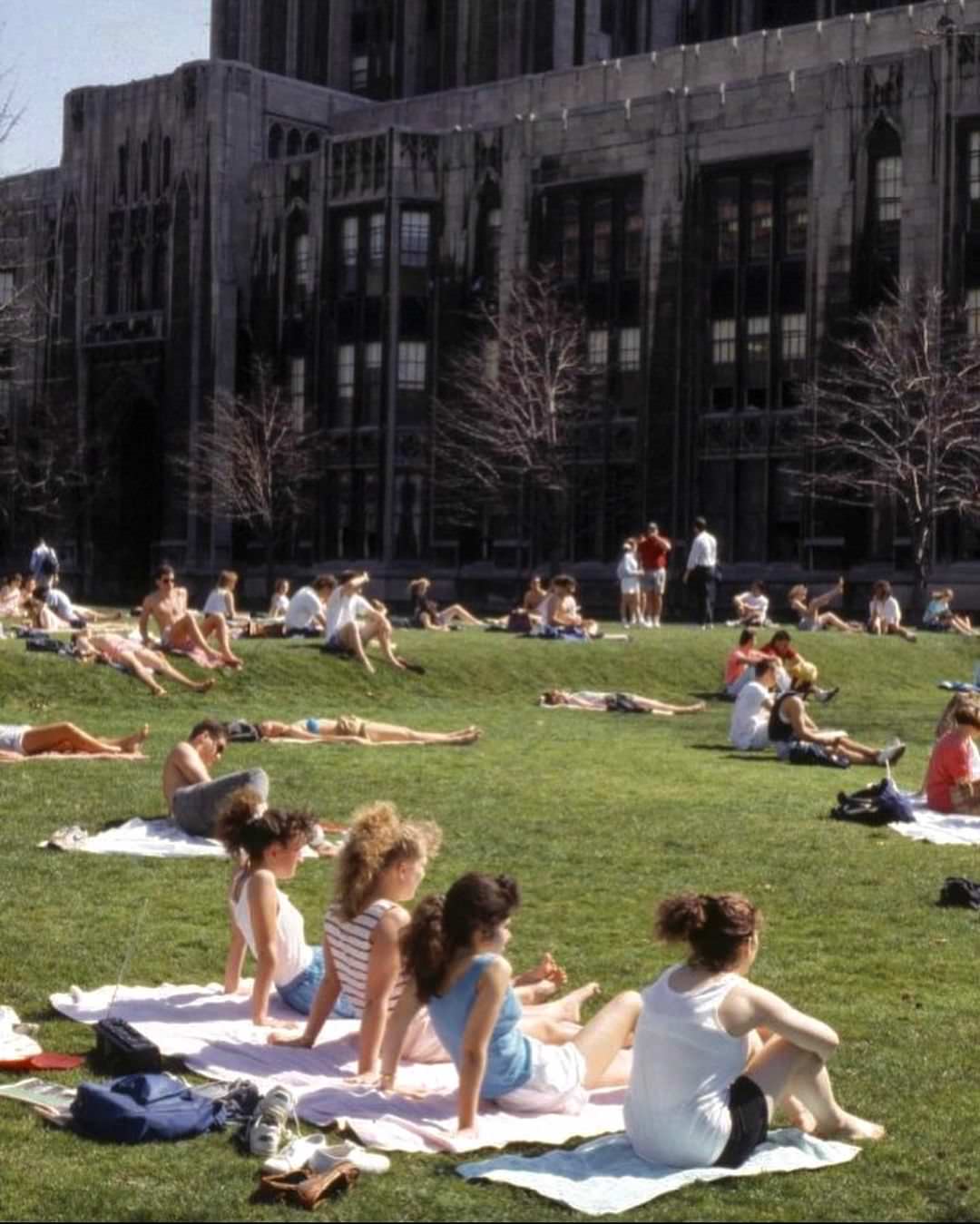 Happy March! Students laying out on the Cathedral lawn around 1990.