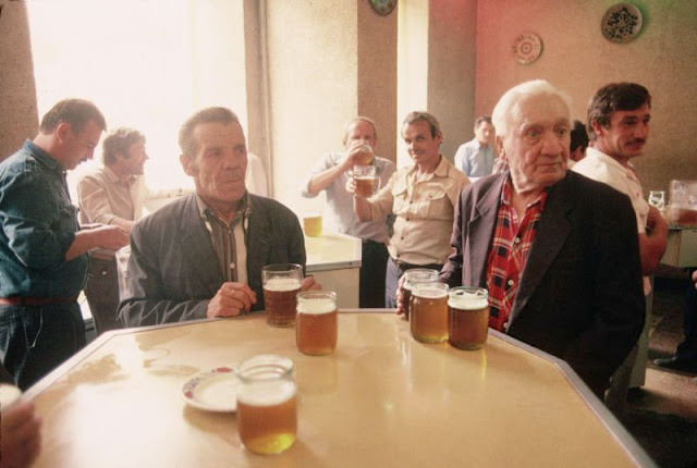 Men drinking beer at bar in Ukraine, 1991
