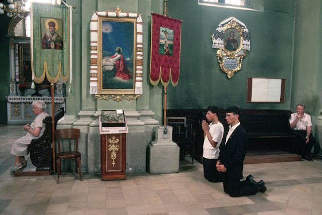 People praying at Orthodox Catholic Church in Ukraine, 1991