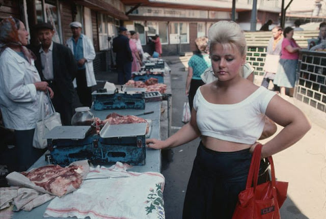 The girl at the meat stall on the street of Lviv, Ukraine, 1991