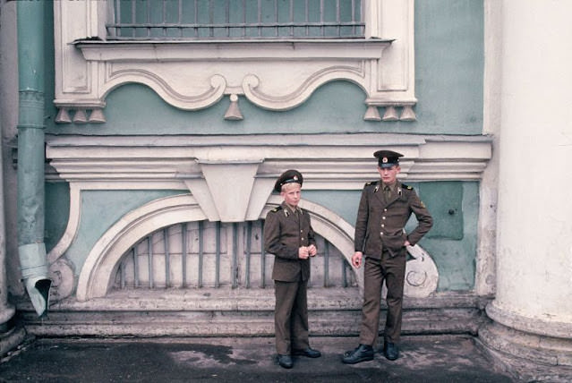Two young police officers outside a building, Ukraine, 1991