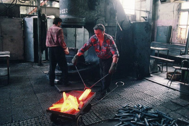 Workers forge metal bars at the Lviv Bus Plant (Lvivsky Avtobusny Zavod, or LAZ), Lviv, Ukraine, 1991