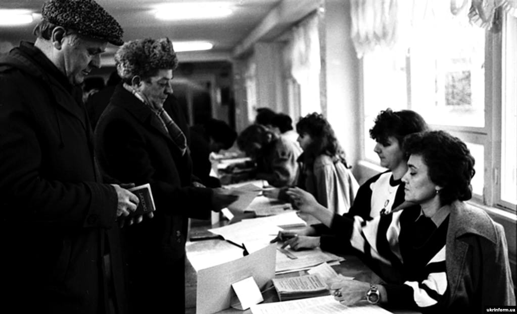 Voters in Odesa sign in to receive their ballots.