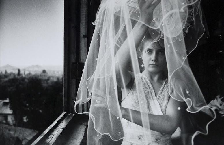 Irina preparing her veil on her wedding day, June 1993.